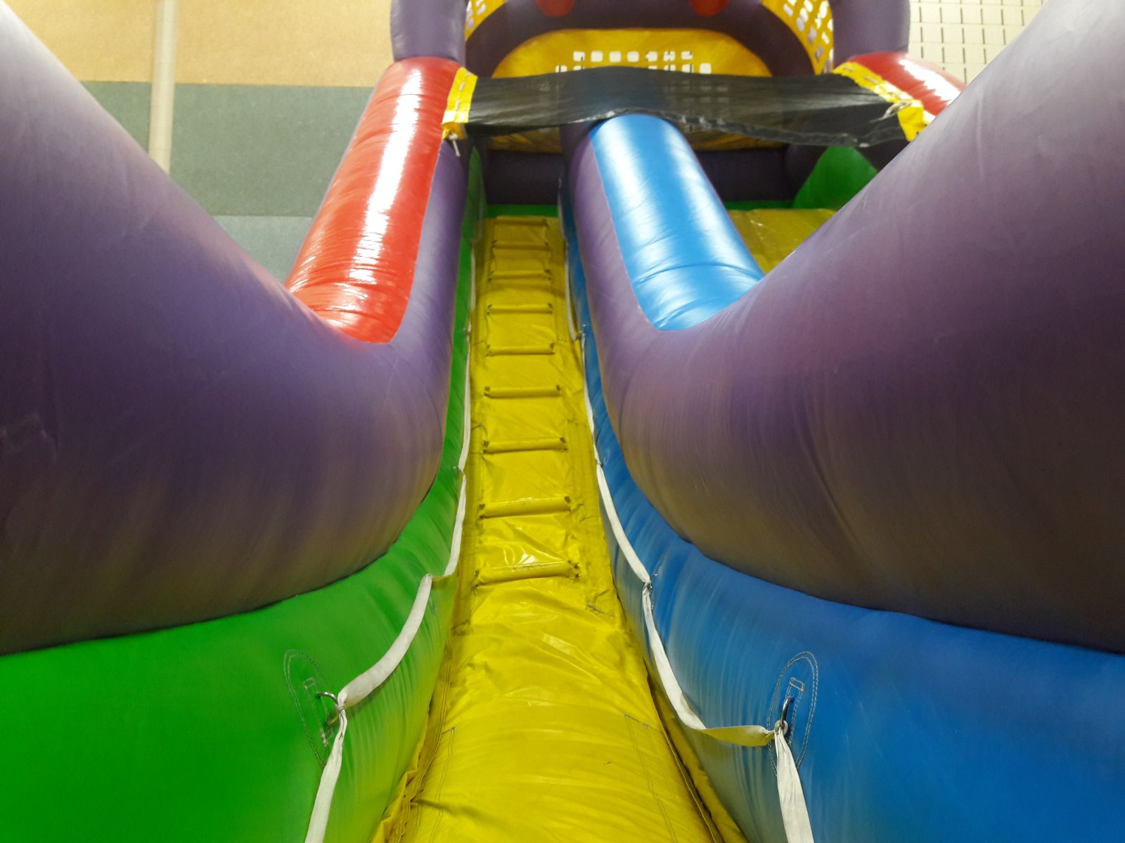 Climbing wall to the top of the 18 foot tall Ultimate Dry Slide Inflatable Rental